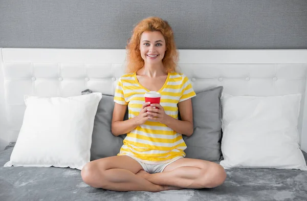 happy woman with morning coffee in bed. good morning. woman with coffee cup. woman hold coffee in the morning.