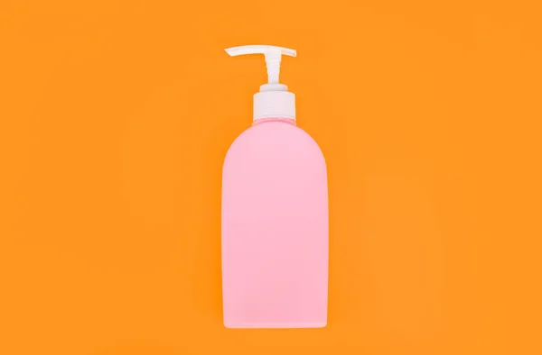 presenting soap dispenser product. unbranded sanitizer advertisement. daily habit and personal care. skincare beauty cosmetic on yellow background. toiletries for hygiene.