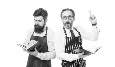 inspired housewife men cooking. Culinary ingredient. catering business. seating plan. bearded men with recipe book. menu planning. happy chef team in apron. cafe and restaurant opening. just inspired.