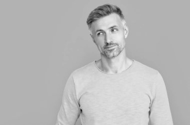 mature caucasian man at studio. mature caucasian man on background. photo of mature caucasian man with glasses. mature caucasian man isolated on blue.