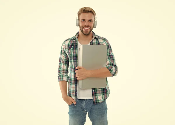 smiling millennial man student in studio. photo of millennial man student with laptop. millennial man student isolated on white. millennial man student on background.