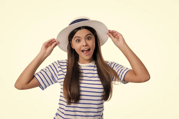 stock image summer stylish amazed teen girl isolated on white. summer stylish teen girl on background. summer stylish teen girl in studio. photo of summer stylish teen girl wearing hat.