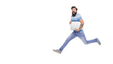 Energetic freelance worker in midair. Happy freelancer holding laptop. Bearded man jumping isolated on white. Freelance work. Freelancing online, copy space.