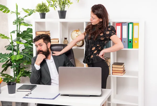 stock image Woman boss touching and harassing man secretary working in office, harassment.