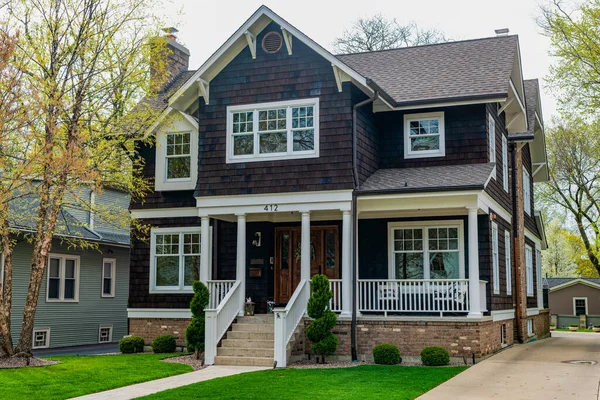 stock image cottage house in american neighborhood. suburban house property. property insurance. real estate. residential house architecture in america. Architecture in suburban neighborhood. Spacious house.