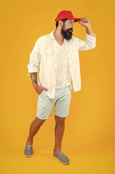 stock image stylish cool casual man in studio. cool casual man on background. photo of cool casual man with moustache. cool casual man isolated on yellow.