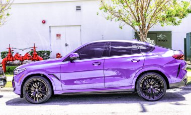 Miami Beach, Florida USA - April 15, 2021: parked blue bmw x6 sdrive 40i, side view.