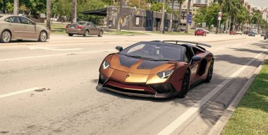 Miami Beach, Florida USA - April 15, 2021: brown Lamborghini Aventador LP 750-4 SV, front view.