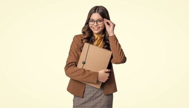 teen school girl in white studio. teen school girl on background. photo of teen school girl with folder. teen school girl isolated on white.