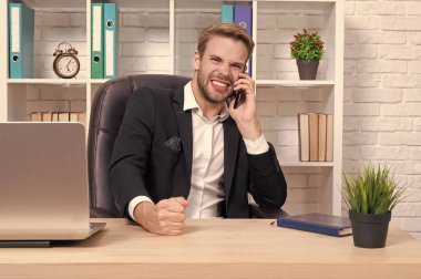 businessman has phone talk isolated on white. businessman has phone talk in studio. businessman has phone talk on background. photo of businessman has phone talk.