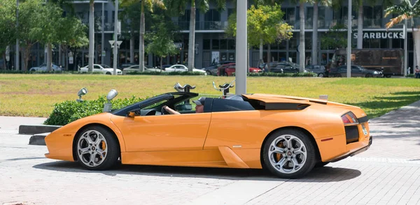 Miami Beach, Florida USA - April 15, 2021: yellow lamborghini diablo v12 6.2L, side view. convertible supercar.