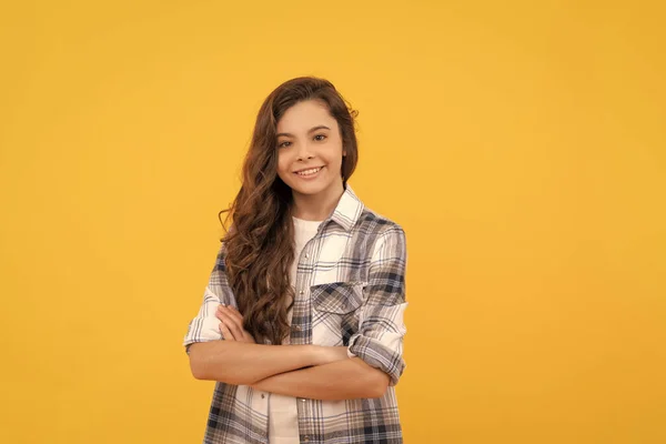 Happy Teen Girl Checkered Shirt Long Curly Hair Yellow Background — Foto de Stock