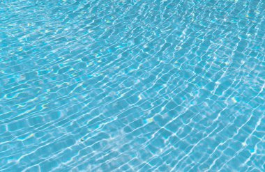 summer pool water background with nobody, bermudas. photo of summer pool water background. summer pool water background. summer pool water background with ripples.