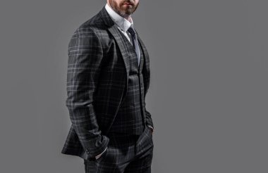 boss in formalwear isolated on grey background with copy space. boss wearing formalwear in studio. photo of boss wear formalwear. boss in formalwear suit.
