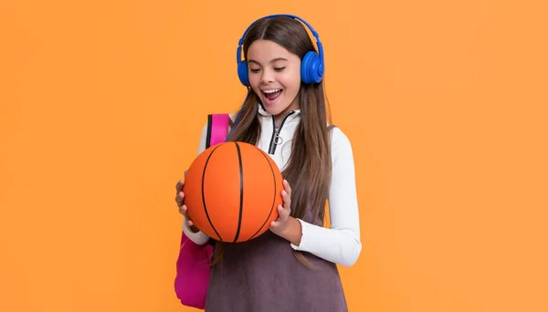 Amazed Kid Headphones School Backpack Basketball Ball Yellow Background — Foto Stock