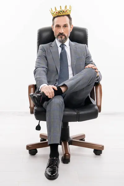 big boss. business success and leadership. successful businessman leader sit in office chair. motivation and reward. businessman boss in suit. leadership concept. business leader man in crown.