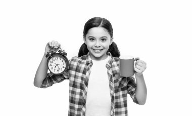 happy girl with morning coffee and alarm isolated on white. girl with morning coffee and alarm in studio. girl with morning coffee and alarm on background. photo of girl with morning coffee and alarm.