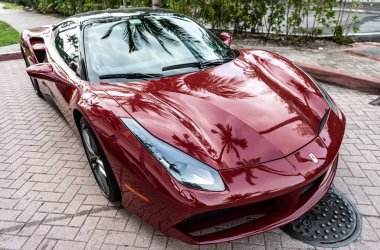 Miami Beach, Florida USA - April 18, 2021: red Ferrari 488 GTB, corner view high angle.