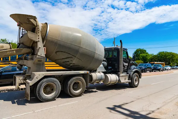 stock image Dallas, USA - April 24, 2023: Tiseo Paving company Kenworth concrete mixer truck lateral view.