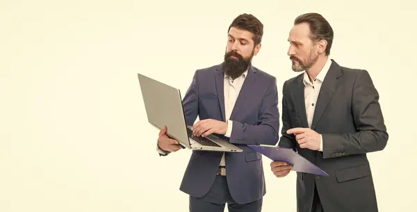 Modern technologies. Partnership. Business technologies. Director boss surfing internet. Colleagues work. Software technologies for accounting. Man bearded manager show financial report laptop.