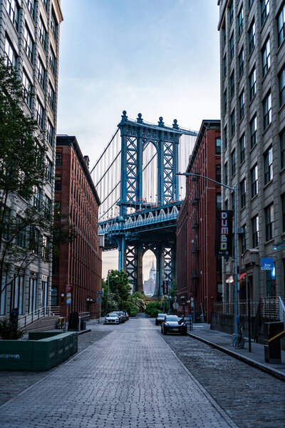 Manhattan, New York City USA - July 15, 2023: manhattan bridge in new york street connecting Lower Manhattan at Canal Street with Downtown Brooklyn crossing east river.