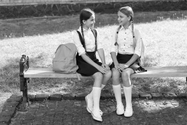 back to school. two happy teen children after school outdoor. friendship of school girls.