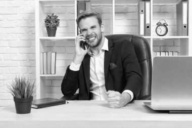 businessman has phone talk isolated on white. businessman has phone talk in studio. businessman has phone talk on background. photo of businessman has phone talk.