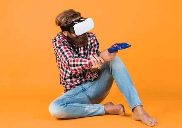 play the game. guy getting experience using VR-headset glasses. bearded hipster use modern technology. game console. man with glasses of virtual reality. Future technology. Visual reality concept.