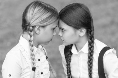 confrontation of two teen school girls. school conflict. opposition of school girls.