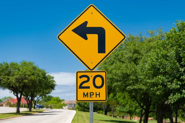 mph and turn signal. road sign of 20 mph and turning signal. caution yellow roadsign. traffic sign on the road outdoor. attention caution road sign.