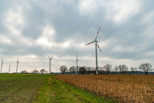 Green energy. energy technology. windmill turbines generating green energy. Windmill for power production. Offshore Windmill farm. wind turbines. windmill view. wind turbine generator for electricity.