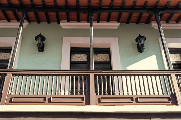 photo of balcony railings fence with roof. balcony railings on house. balcony railings facade. balcony railings outdoor.