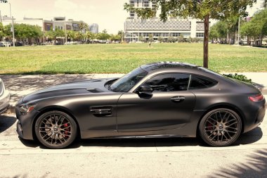Miami Beach, Florida USA - April 15, 2021: matte mercedes benz v8 biturbo, side view high angle.