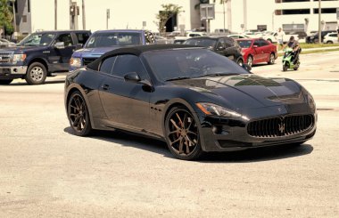 Miami Beach, Florida USA - April 15, 2021: black maserati gran turismo, corner view.