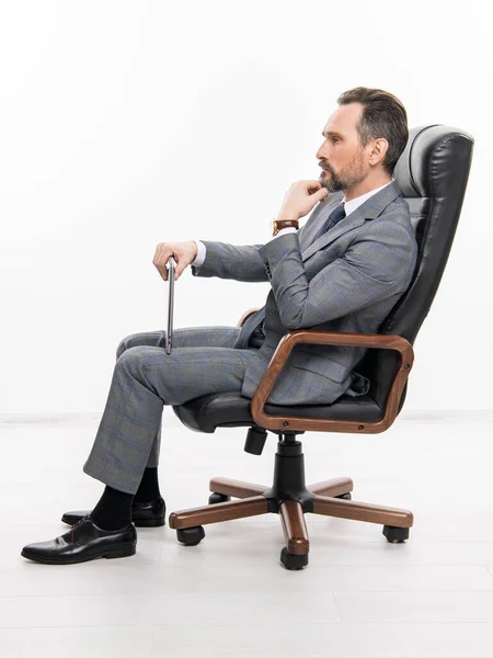 businessman in office chair. man in suit representing leadership. business leadership and success. businessman leader sitting in office chair. business success. professional leader ceo.