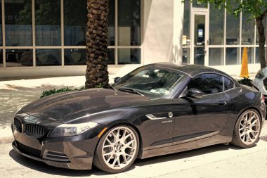 Miami Beach, Florida USA - April 15, 2021: 2010 BMW Z4 sDrive35i roadster car, side view.