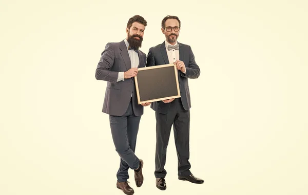 Sales report. bearded men hold advertisement blackboard. businessmen in suit, copy space. announcement. party invitation. partners celebrate start up business isolated on white. welcome on board.