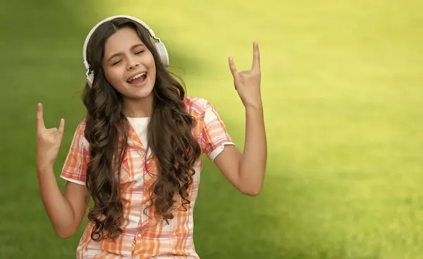 cool teen girl listen music. teen girl listen music. teen girl listen music outdoor. teen girl listen music outside.