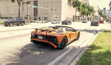 Miami Beach, Florida USA - April 15, 2021: orange Lamborghini Aventador LP 750-4 SV, back view.