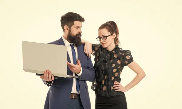 Internet to keep business running. Business couple work online. Sexy woman and bearded man send e-mail via computer. Internet electronic communication. Information network. Internet virtual office.