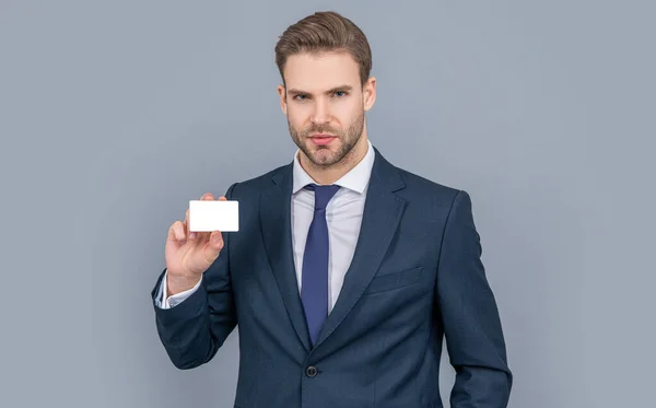 Business branding. Pay the bill. handsome businessman with credit card in studio. Business deal with emoney. Success of business. businessman in suit hold credit card isolated on grey.
