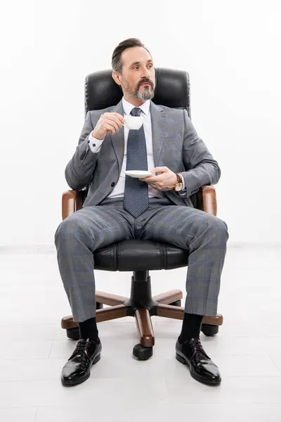 business leadership and success. businessman leader sit in office chair. business success of salesman. professional leader ceo. businessman in office chair. man in suit representing leadership.