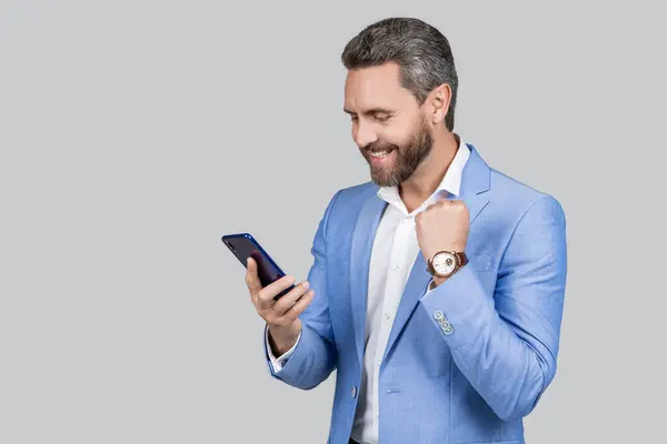 Businessman use phone. Man phone conversation in studio. Middle aged hispanic business man with phone. Business communication. Casual business man chatting on phone isolated on grey. this is success.