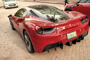 Miami Beach, Florida USA - April 18, 2021: luxury red Ferrari 488 GTB, back view.