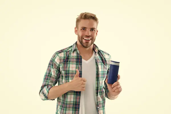 photo of cheerful man with haircare cosmetics. man with haircare cosmetics isolated on white. man with haircare cosmetics on background. man with haircare cosmetics in studio.