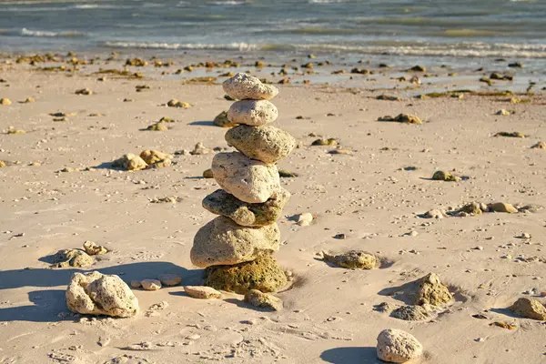 zen like summer. stone pyramid at sea. summer nature with zen pebble. life equilibrium. balance and harmony in life. harmony and balance. zen pebble at beach. nature balance concept. inner calm.