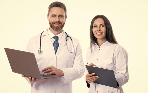 happy doctor with internist noting ehealth. doctor and internist wear white coat and noting ehealth. internist and doctor with laptop and anamnesis. doctor and internist do ehealth noting
