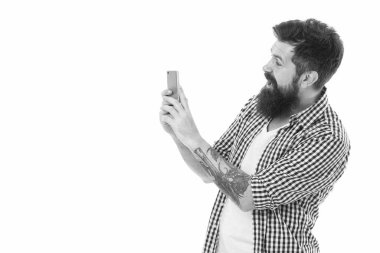 Document every moment. Bearded hipster man hold smartphone or mobile phone white background copy space. Modern communication. Mobile communication concept. Mobile photography. Augmented reality.