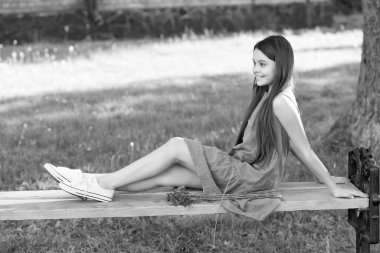 happy teenager girl relax in park. teen girl outdoor. pretty girl in summertime.