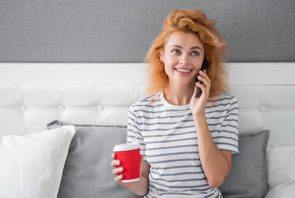 woman smile with coffee speak on phone. woman at home speaking on phone. speaking on phone woman at home.